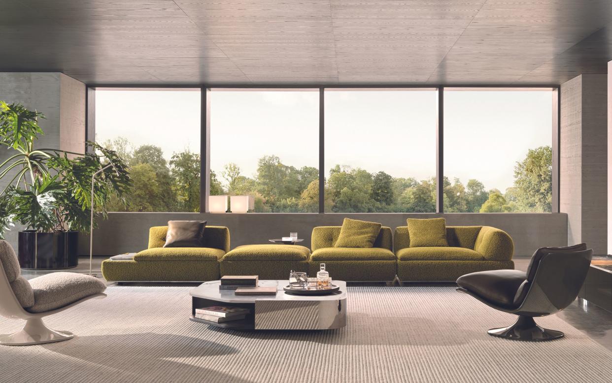  Milan Design Week Minotti living room with green sofa. 