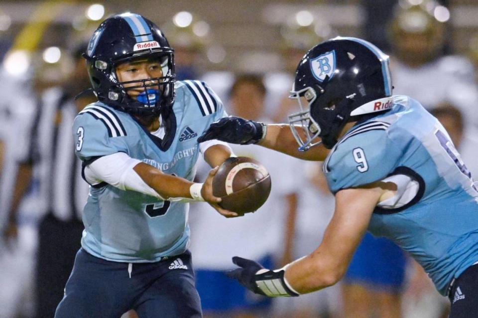 Bullard quarterback Jerren Mao, let, hands off to Nick Stubblefield, right, Friday, Sept. 15, 2023 in Fresno. ERIC PAUL ZAMORA/ezamora@fresnobee.com