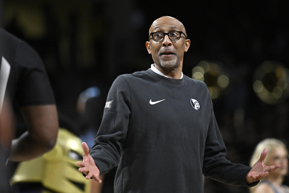 Central Florida head coach Johnny Dawkins makes a point with an official during a timeout in the first half of an NCAA college basketball game against Iowa State, Saturday, March 2, 2024, in Orlando, Fla. (AP Photo/Phelan M. Ebenhack)