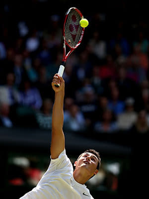 Bernard Tomic of Australia serves during the Gentlemen's Singles third round match against Richard Gasquet of France on day six of the Wimbledon Lawn Tennis Championships at the All England Lawn Tennis and Croquet Club on June 29, 2013 in London, England.