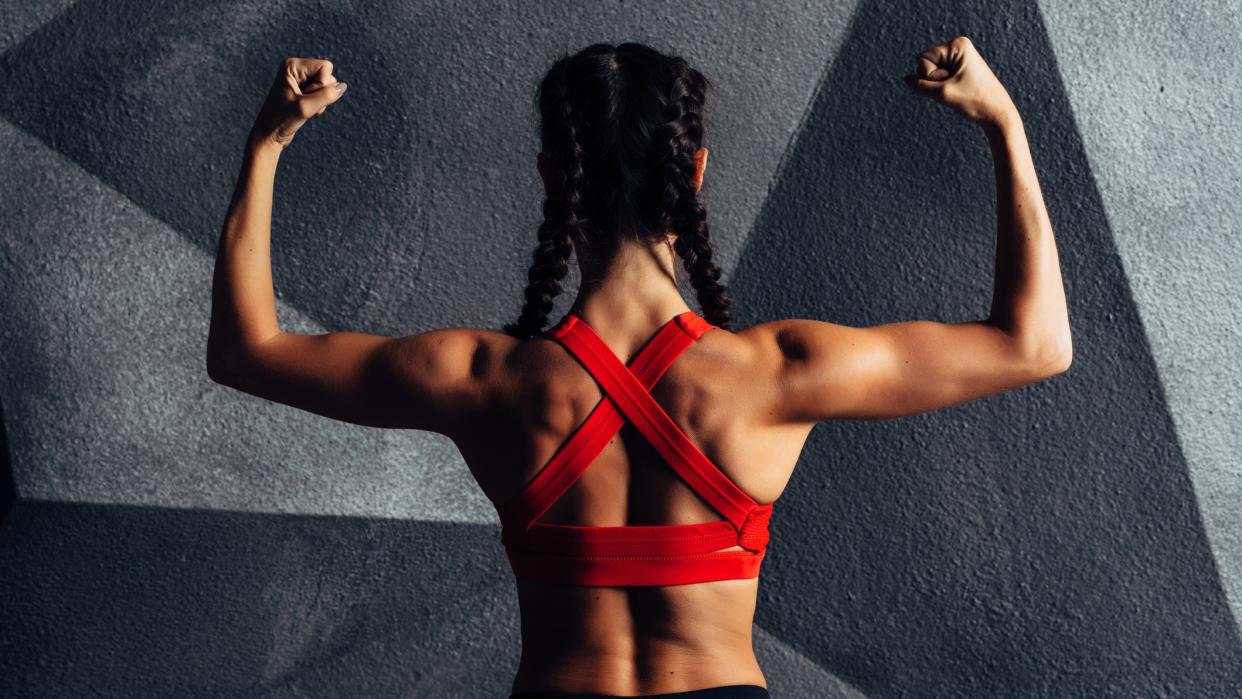  a photo of a woman with strong shoulders 