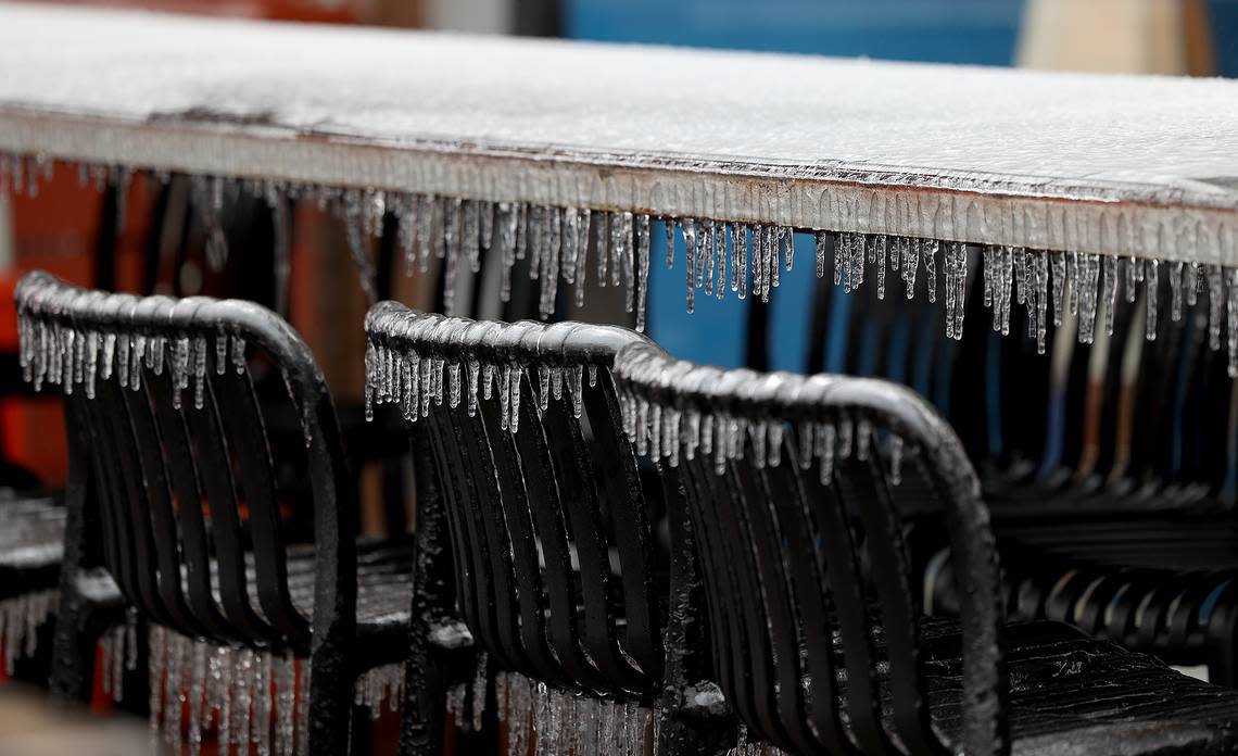 Ice coats outdoor seating on the patio of Yucatan Tequila Bar and Grill in Fort Worth on Thursday, February 2, 2023. Temperature began rising above freezing on Thursday, helping to clear roads from ice.