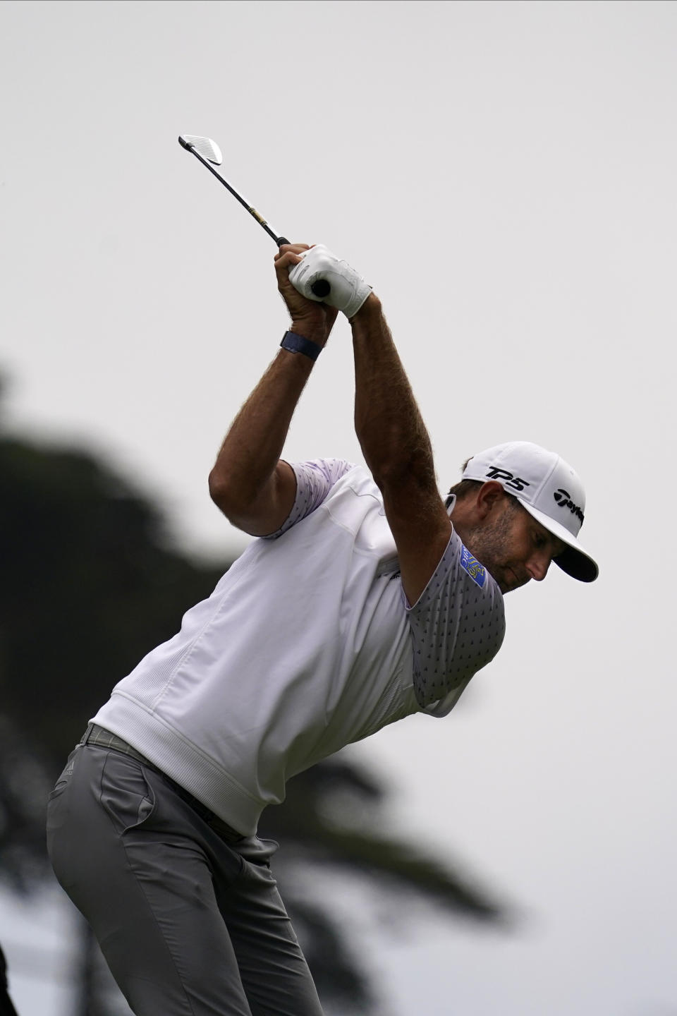 Dustin Johnson hits his tee shot on the second hole during the third round of the PGA Championship golf tournament at TPC Harding Park Saturday, Aug. 8, 2020, in San Francisco. (AP Photo/Jeff Chiu)