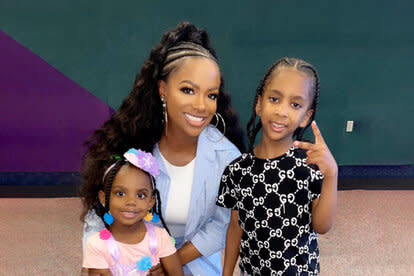 Kandi Burruss, Blaze Tucker, and Ace Tucker, pose for a photo together.