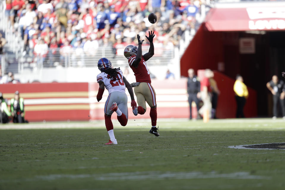 San Francisco 49ers wide receiver Marquise Goodwin (11) catches a touchdown pass in front of New York Giants cornerback Janoris Jenkins (20) during the first half of an NFL football game in Santa Clara, Calif., Sunday, Nov. 12, 2017. (AP Photo/Marcio Jose Sanchez)