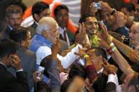 Prime Minister Narendra Modi meets members of the Australian-Indian community during a reception at the Allphones Arena located at Sydney Olympic Park in western Sydney November 17, 2014. REUTERS/Rick Stevens