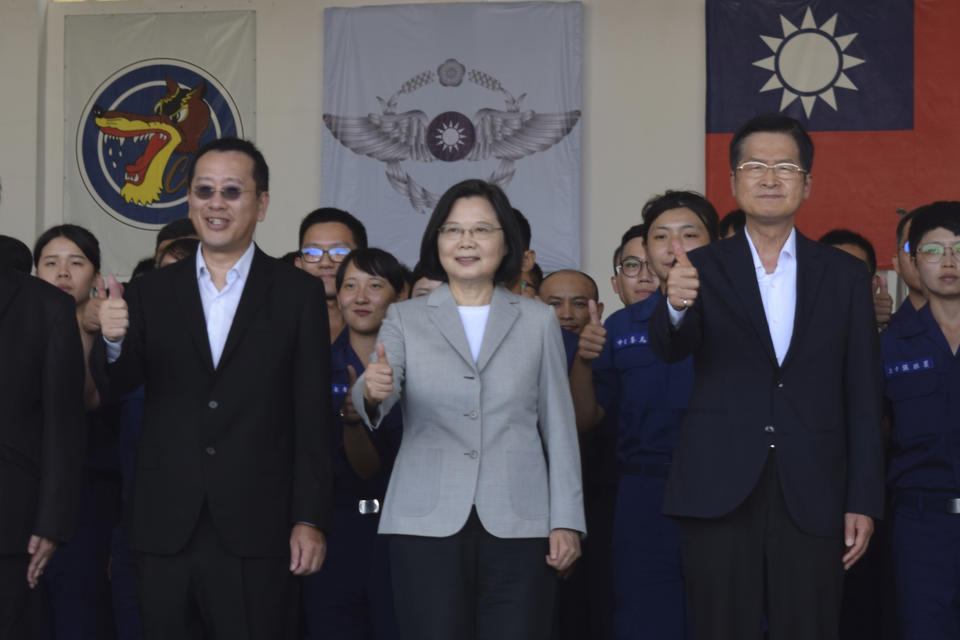 Taiwan President Tsai Ing-wen, center, poses for photos at the Penghu Magong military air base in outlying Penghu Island, Taiwan Tuesday, Sept. 22, 2020. Tsai visited the military base on one of Taiwan’s outlying islands Tuesday in a display of resolve following a recent show of force by rival China. (AP Photo/Wu Huizhong)