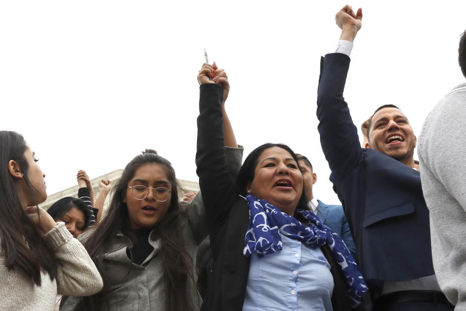 Martin Batalla Vidal, one of the lead plaintiffs, far right, holds his hand up in the air as he walks with other DACA recipients and supporters from the Supreme Court after oral arguments were heard in the case of President Trump's decision to end the Obama-era, Deferred Action for Childhood Arrivals program (DACA), Tuesday, Nov. 12, 2019, in Washington. (AP Photo/Jacquelyn Martin)