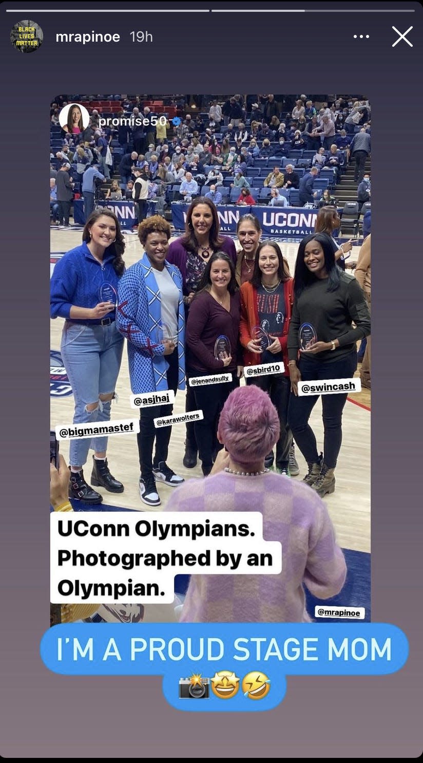 Megan Rapinoe photographs Sue Bird and other former UConn stars.