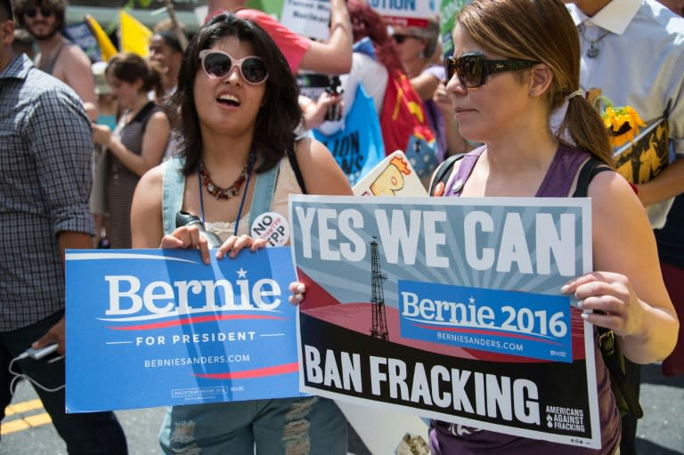 Supporters of former US Democratic presidential candidate Bernie Sanders march in support of clean energy and the environment in Philadelphia on July 24, 2016