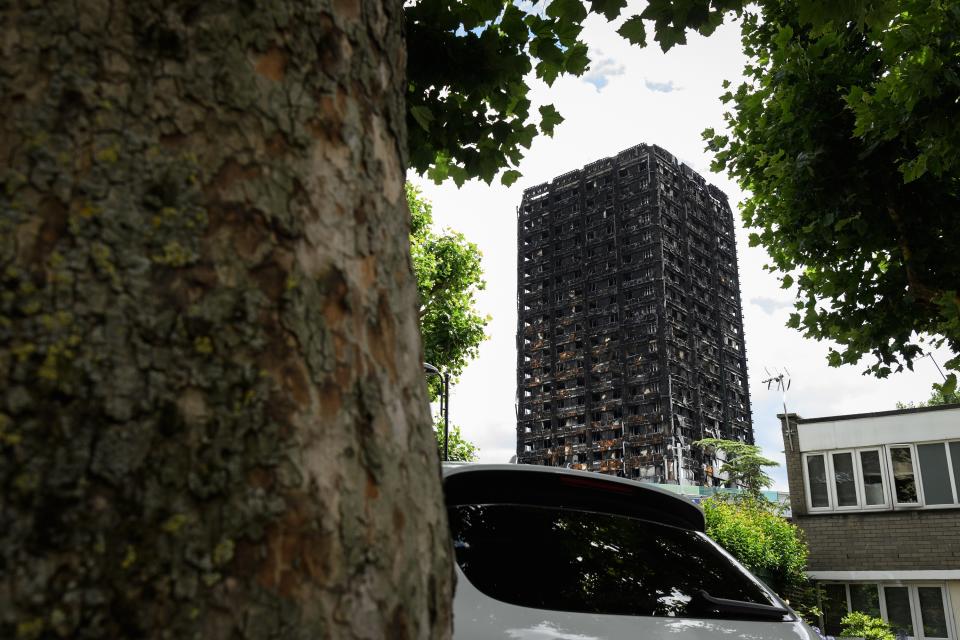 The blackened block is pictured a month after the fire that claimed the lives of at least 80 people (Leon Neal/Getty Images)