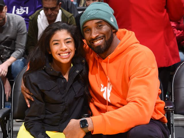 <p>Andrew D. Bernstein/NBAE/Getty</p> Kobe Bryant and Gianna Bryant attend a game between the Los Angeles Lakers and the Dallas Mavericks in 2019.