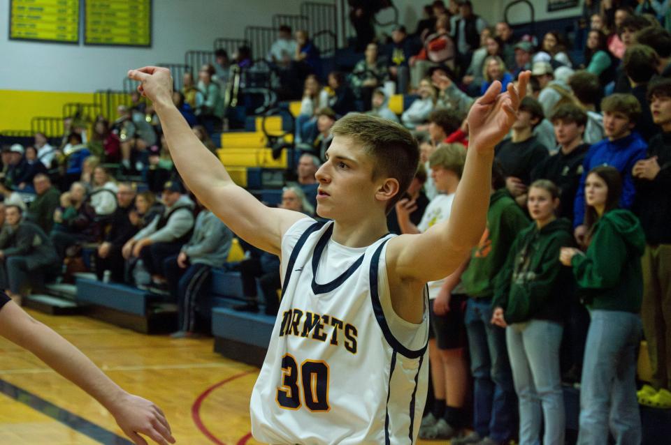 Evan Towne (30) looks to sink a 3-pointer.