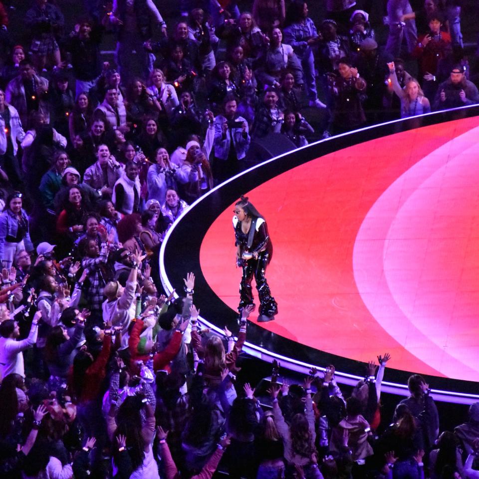 H.E.R. performs on stage during the Halftime Show