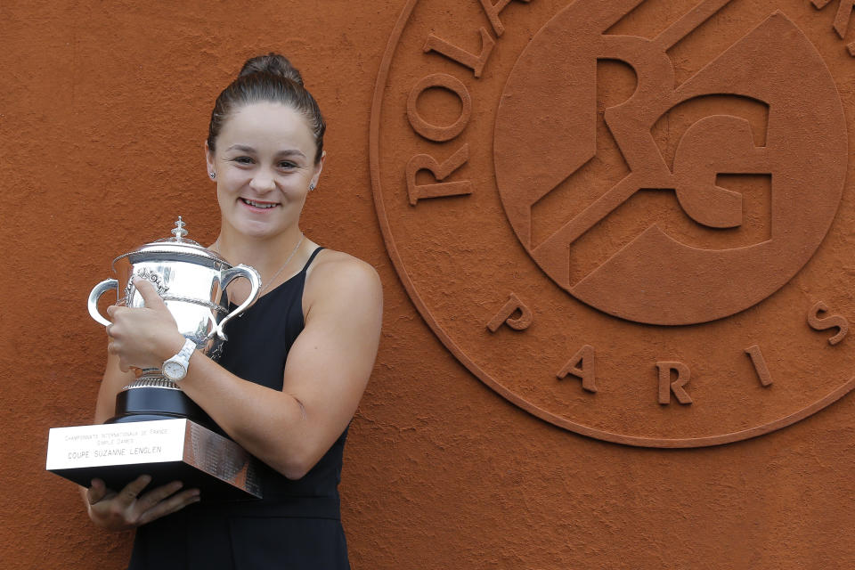 Australia's Ashleigh Barty poses with the trophy during a photo call at the Roland Garros stadium in Paris, Sunday, June 9, 2019. Barty won the French Open tennis tournament women's final on Saturday June 8, 2019. (AP Photo/Michel Euler)