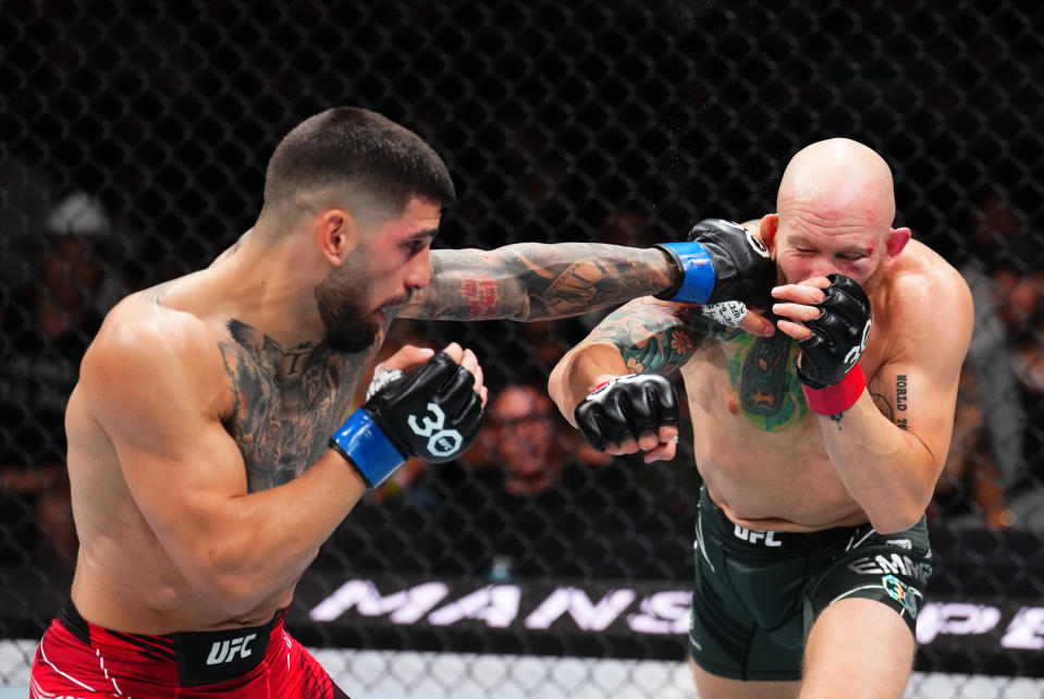 JACKSONVILLE, FLORIDA - JUNE 24:  (L-R) Ilia Topuria of Germany punches Josh Emmett in their featherweight fight during the UFC Fight Night event at Vystar Veterans Memorial Arena on June 24, 2023 in Jacksonville, Florida. (Photo by Josh Hedges/Zuffa LLC)