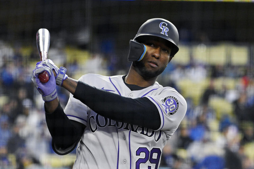 Colorado Rockies' Jurickson Profar warms up in the on-deck circle during the first inning of a baseball game against the Los Angeles Dodgers Monday, April 3, 2023, in Los Angeles. (AP Photo/Mark J. Terrill)