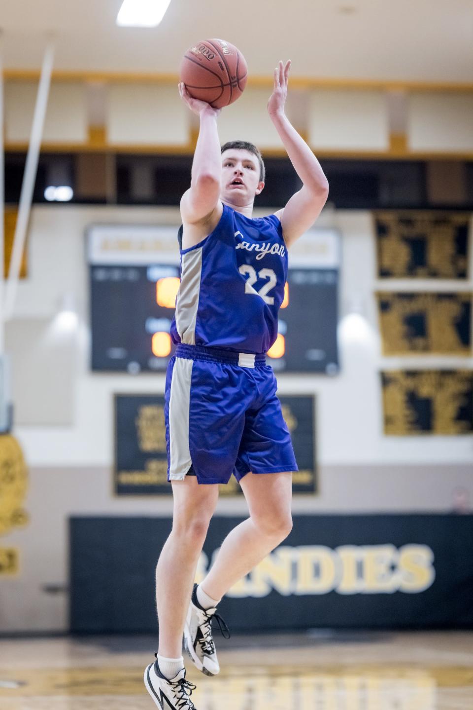 Canyon Eagle’s Chris Bryant (22) takes a shot from the paint during an away game against the Amarillo High Sandies on Tuesday, January 4, 2022 in Amarillo, TX.