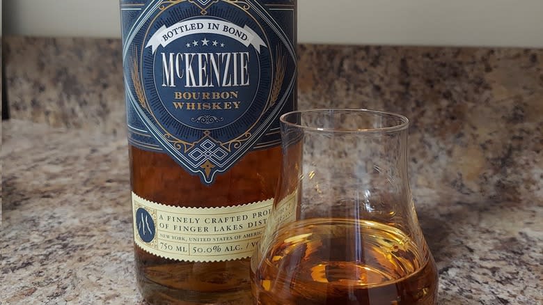 Bottle and glass of McKenzie Bourbon