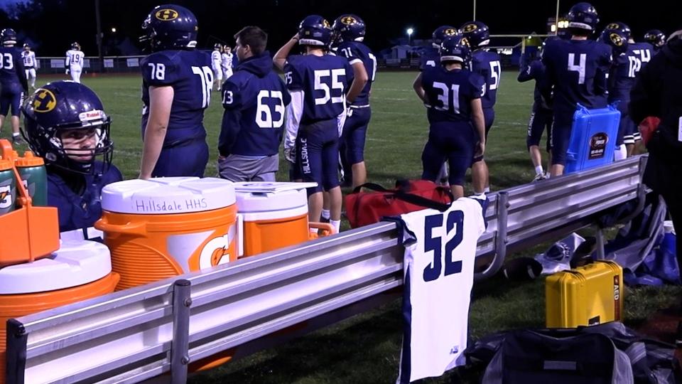 Hillsdale players honored former teammate and '23 HHS graduate Clayton Bowditch by running onto the field for kickoff with his jersey and presenting it on the sidelines for the duration of their game.