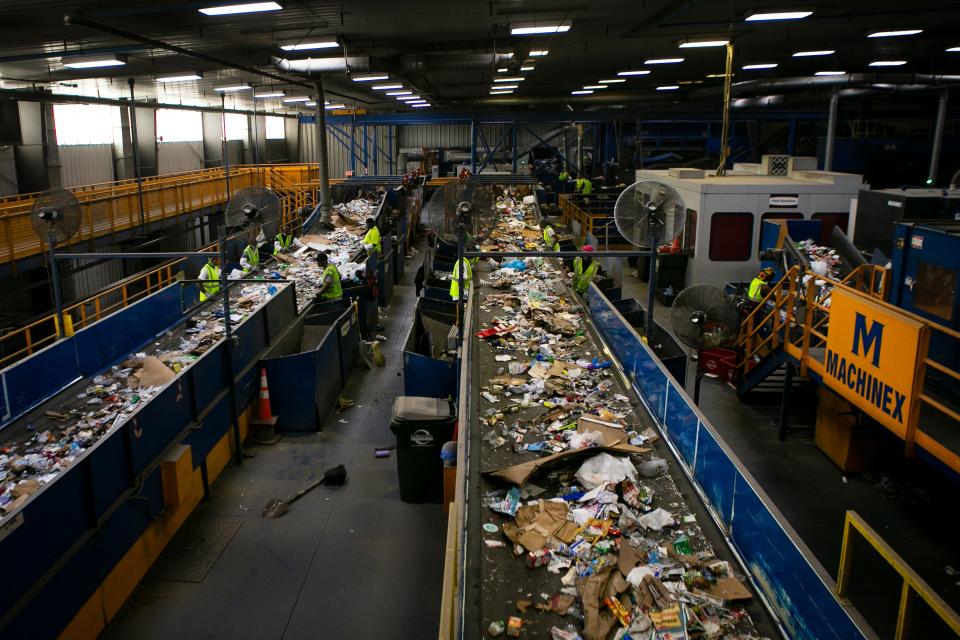 Materials are sorted and divided up at the Rumpke Recycling Facility on August 24, 2021. 