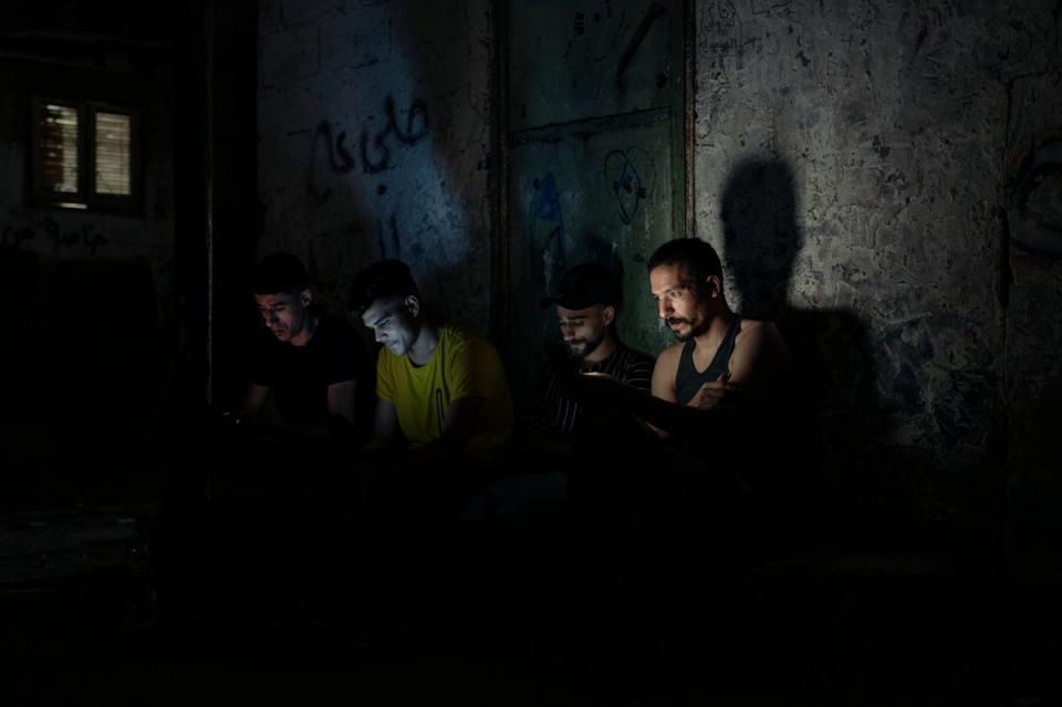 Omar, 32, and his friends explained that they have no recollection of Gaza ever having 24 hours of electricity (Paddy Dowling)
