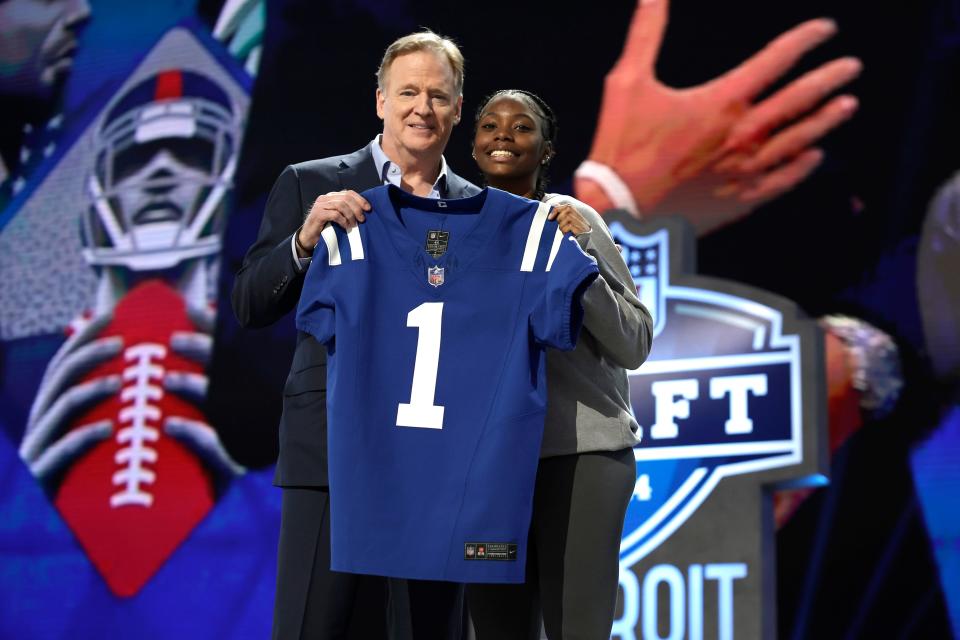 South Bend Riley junior Kayla Wright, right, and NFL Commissioner Roger Goodell take a photo after Wright handed the Indianapolis Colts' first-round draft choice jersey to Goodell at the NFL Draft Thursday, April 25, 2024, in Detroit.