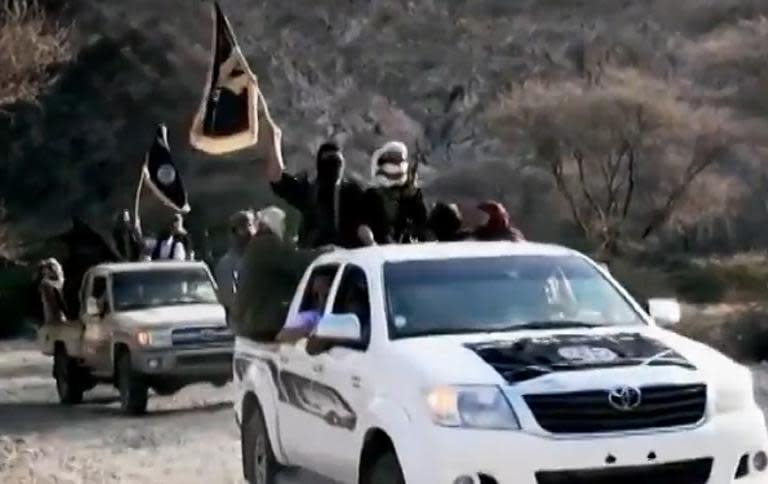 An image taken on April 16, 2014 from a video released by Al-Malahem Media, the media arm of Al-Qaeda in the Arabian Peninsula (AQAP), allegedly shows AQAP jihadists arriving at a meeting with their chief Nasser al-Wuhayshi, in Yemen