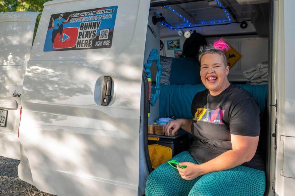 Crystal Carroll, who goes by @bunnyplayshere on social media, gives a tour of her van while attending a festival of RVs, vans and buses at Camp Branch on Smithville Lake. 