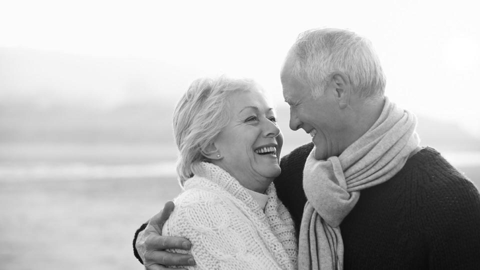 happy older couple on a walk in the winter