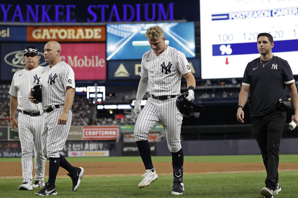 New York Yankees' Trey Amburgey leaves the game after an injury during the fourth inning of the team's baseball game against the Boston Red Sox on Sunday, July 18, 2021, in New York. (AP Photo/Adam Hunger)