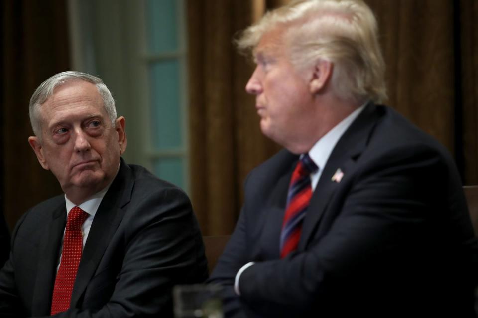 Jim Mattis (left) and Donald Trump (right) at a 2018 press conference. Mr Mattis reportedly thought of Mr Trump as a ‘madman,’ a new book reveals (Getty Images)