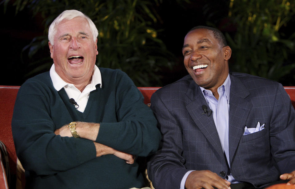 FILE - Former Indiana coach Bob Knight, left, and one of his players at Indiana, Isaiah Thomas, laugh during a taping of Billy Packer's "Survive and Advance" television show Sunday, March 15, 2009, in Las Vegas. Bob Knight, the brilliant and combustible coach who won three NCAA titles at Indiana and for years was the scowling face of college basketball has died. He was 83. Knight's family made the announcement on social media Wednesday evening, Nov. 1, 2023. (AP Photo/Isaac Brekken, File)