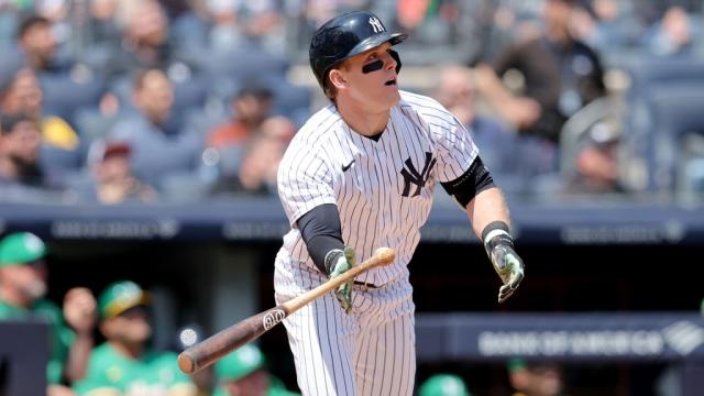 Fan throws shirt at Yankees' Anthony Volpe while running on field