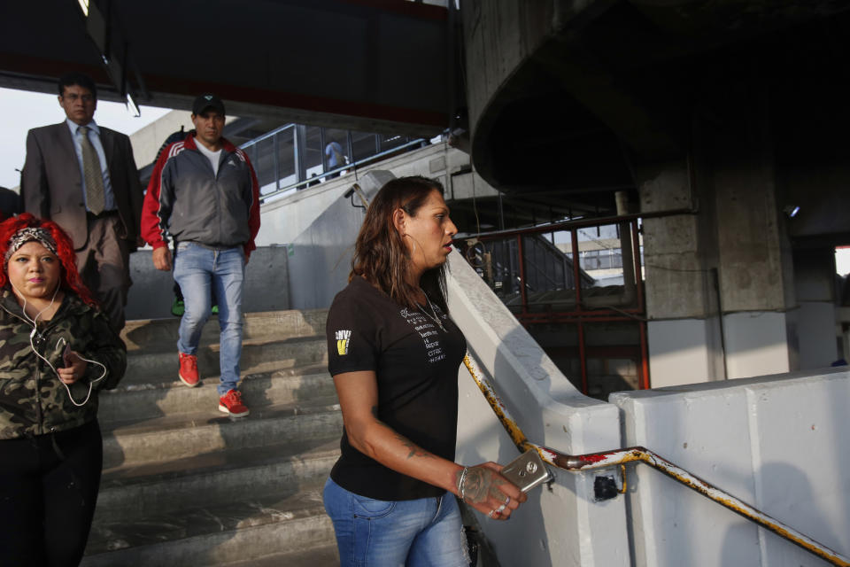 In this Aug. 28, 2019 photo, trans rights activist Kenya Cuevas meets up with her two bodyguards in Mexico City. Mexico has become one of the world's most dangerous countries for transgender people, as high murder rates couple with almost no convictions. (AP Photo/Ginnette Riquelme)