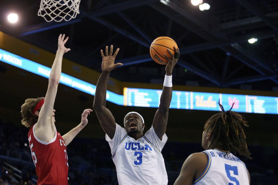 UCLA forward Adem Bona (3) goes to the basket against Utah center Branden Carlson, left, during the second half of an NCAA college basketball game, Sunday, Feb. 18, 2024, in Los Angeles. | Eric Thayer, AP