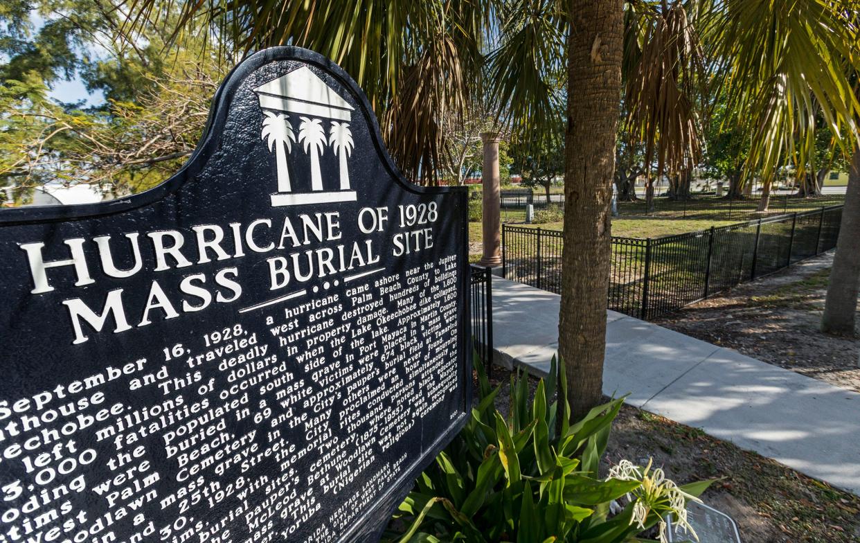 A historic marker at the Hurricane of 1928 mass burial site at the corner of Tamarind Avenue and 25th Street in West Palm Beach.
