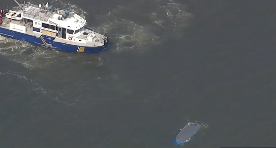 A rescue boat near a capsized boat in the Hudson River on July 12, 2022. / Credit: CBS New York