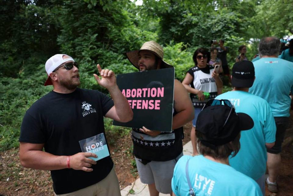 Anti-abortion activists gather at A Preferred Women’s Health Center of Charlotte on Saturday.