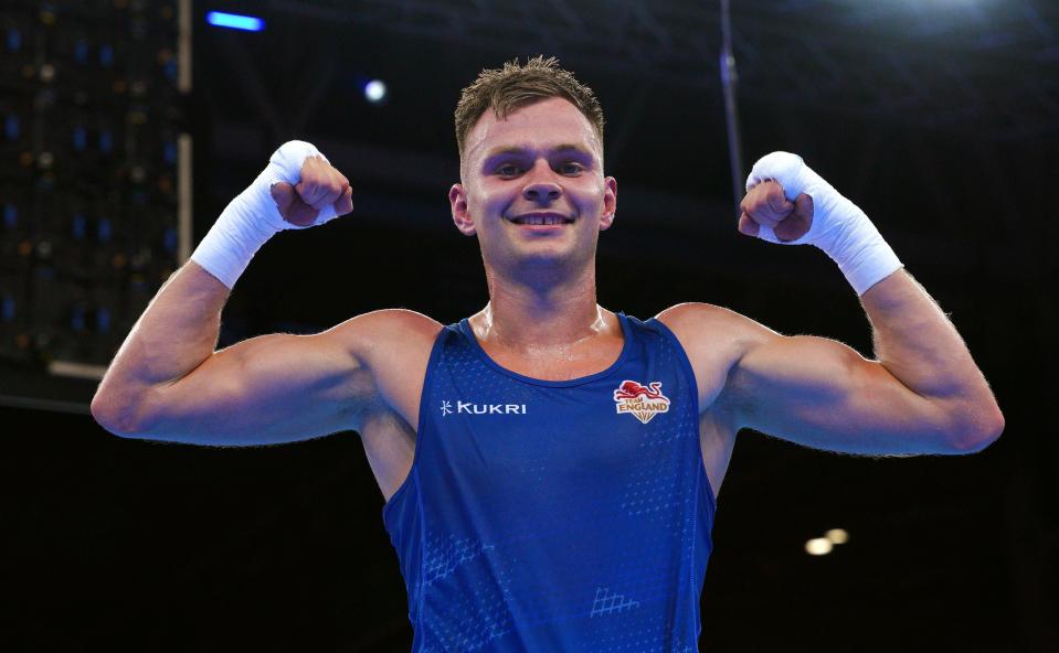 England’s Lewis Richardson (Blue) celebrates victory against Uganda’s Yusuf Nikobeza (PA)