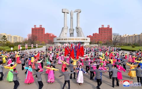 Students dance during a party as they mark the 25th anniversary of Kim Jong Il's election as the chairman of the National Defence Commission of the DPRK in this photo released by North Korea's Korean Central News Agency (KCNA) April 9, 2018 - Credit:  REUTERS /KCNA