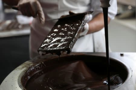 A man gives a chocolate demonstration inside The Chocolate Museum in New York, U.S., May 10, 2017. REUTERS/Shannon Stapleton