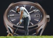 Rory McIlroy of Northern Ireland tees off on the seventh hole during the second round of the 2014 Omega Dubai Desert Classic in Dubai January 31, 2014. REUTERS/Ahmed Jadallah