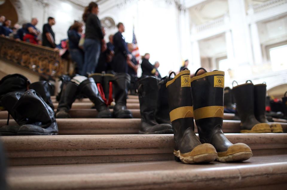 SAN FRANCISCO, CA - MARCH 26:  Firefighter boots line the stairs inside San Francisco City Hall during a remembrance ceremony held for San Francisco firefighters who have died of cancer on March 26, 2014 in San Francisco, California. Over two hundred pairs of boots were displayed on the steps inside San Francisco City Hall to symbolize the 230 San Francisco firefighters who have died of cancer over the past decade. According to a study published by the National Institute for Occupational Safety and Health, (NIOSH)  findings indicate a direct correlation between exposure to carcinogens like flame retardants and higher rate of cancer among firefighters.  The study showed elevated rates of respiratory, digestive and urinary systems cancer and also revealed that participants in the study had high risk of mesothelioma, a cancer associated with asbestos exposure.  (Photo by Justin Sullivan/Getty Images)