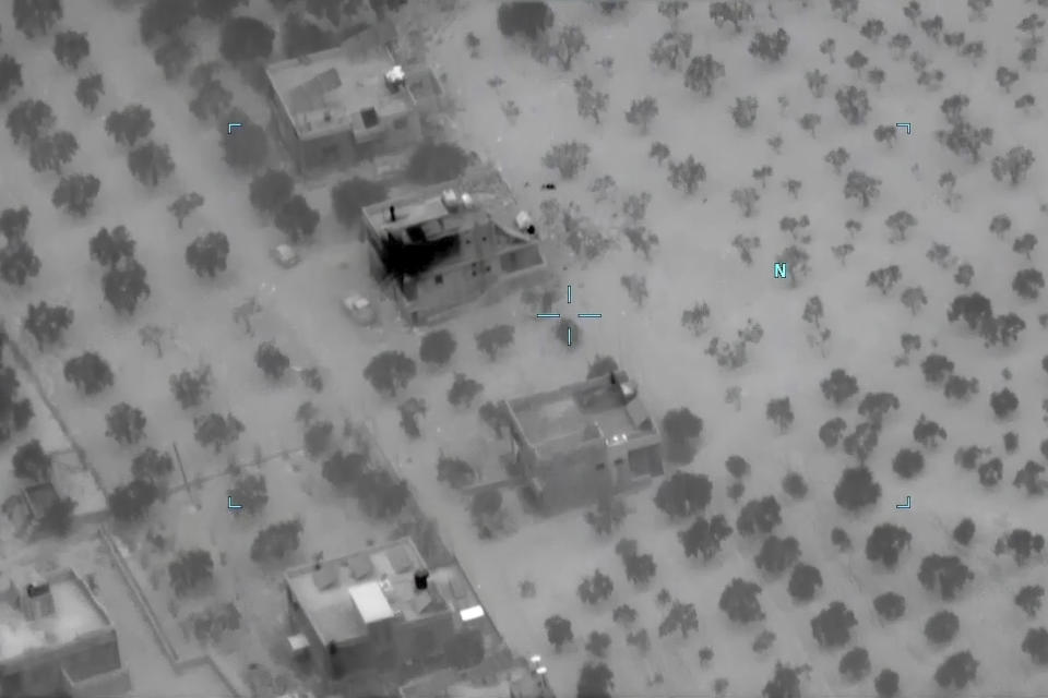 This image from video provided by the Department of Defense and released on Feb. 3, 2022, shows the compound after a raid where Abu Ibrahim al-Hashimi al-Qurayshi, leader of the Islamic State Group, died in Syria's northwestern Idlib province. A U.S. official says that the militant leader, one of the world's most wanted terrorists, exploded a bomb that killed himself and members of his family during the overnight raid by an elite U.S. military force. (Department of Defense via AP)