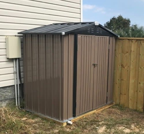 a reviewer photo of the brown and black shed