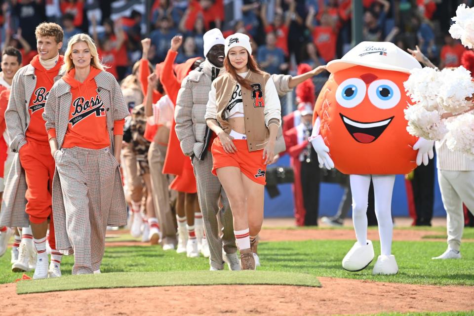 <p>Gigi Hadid leads the bright orange charge on Sept. 23 at the Boss fashion show in Milan, Italy.</p>