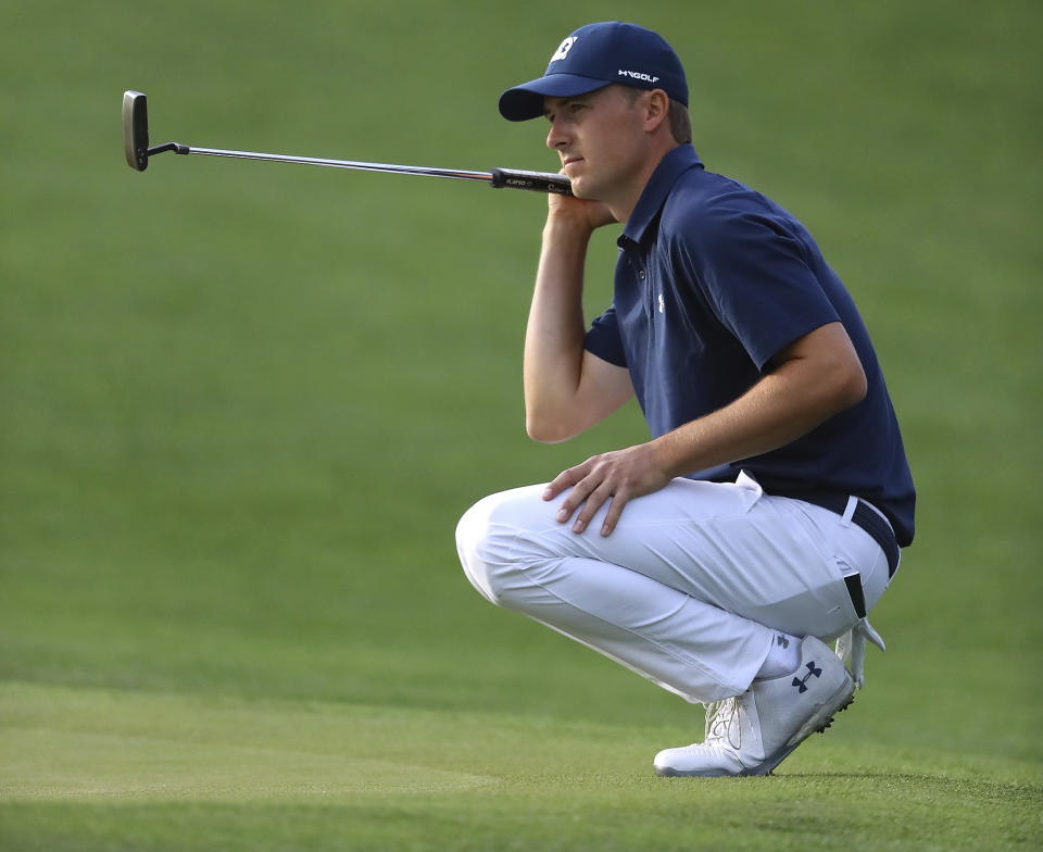 Jordan Spieth looks over his birdie putt on the 17th green during the first round at the Masters golf tournament Thursday. (AP)