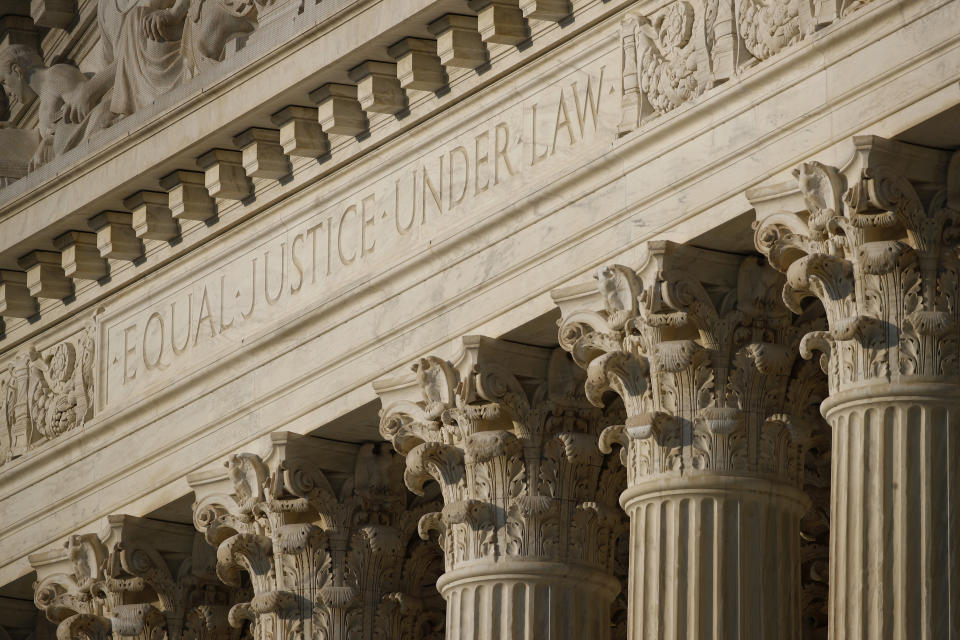 In this May 3, 2020 photo, the setting sun shines on the Supreme Court building on Capitol Hill in Washington. On Monday, May 11, 2020, the Supreme Court will hear arguments in a disability discrimination lawsuit she filed against her former employer, St. James Catholic School in Torrance, California. A judge initially sided with the school and halted the lawsuit, but an appeals court disagreed and said it could go forward.(AP Photo/Patrick Semansky)