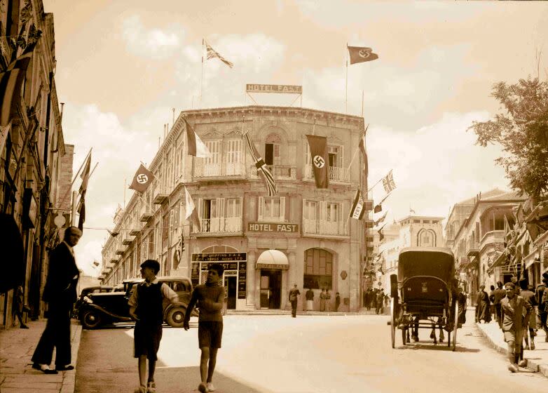 Hotel Fast in Jerusalem displays both British and Nazi flags in 1937.